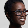 Woman wearing IZIPIZI Reading Glasses Collection #C Tortoise with a neutral background