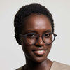 Woman wearing IZIPIZI Reading Glasses Collection #D in tortoise with a neutral background 