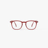 Red eyeglasses on a white background