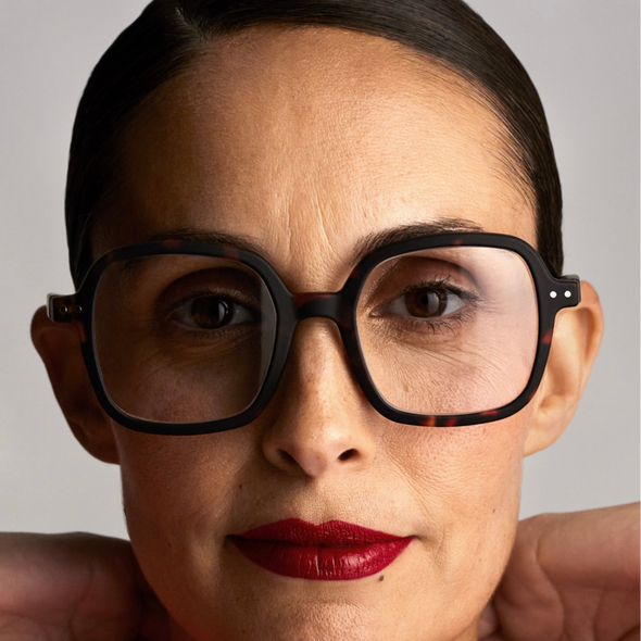 Close-up of a person wearing IZIPIZI Reading Glasses Collection Office in Tortoise with a neutral background