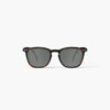 Sunglasses with tortoiseshell frame and dark lenses on a white background