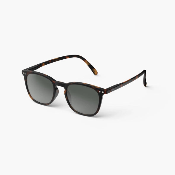 Sunglasses with tortoiseshell frame and dark lenses on a white background