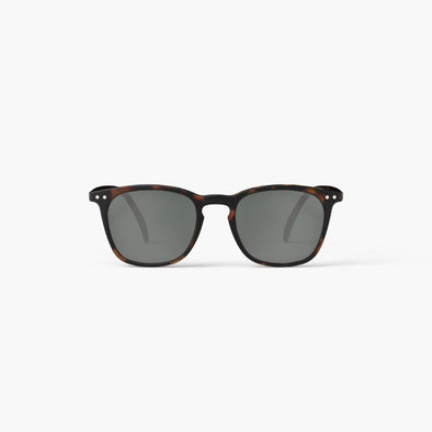 Sunglasses with tortoiseshell frame and dark lenses on a white background