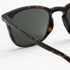 Sunglasses with tortoiseshell frame and dark lenses on a white background