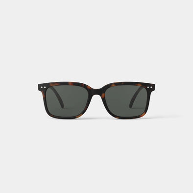 Sunglasses with tortoiseshell frame and dark lenses on a white background