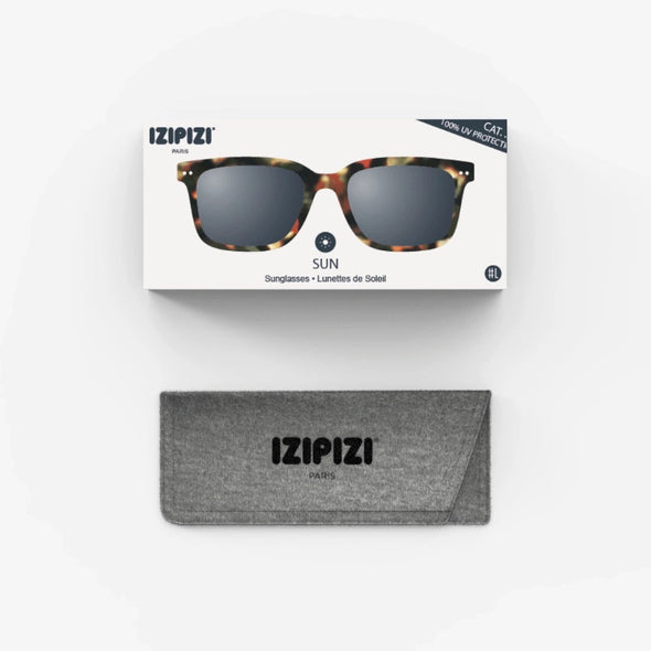 Izipizi sunglasses with packaging and case on a white background