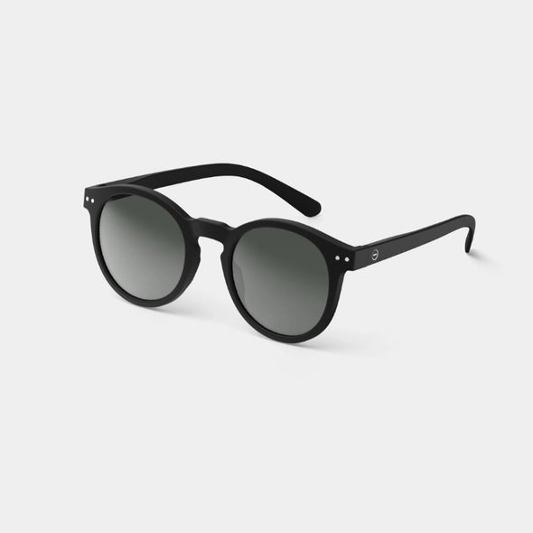Black sunglasses with round lenses on a white background