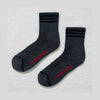Pair of dark gray socks with red text on a light gray background