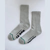 Gray socks with black text on a white background