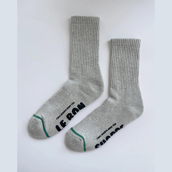 Gray socks with black text on a white background