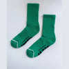 Pair of green socks with text on a white background