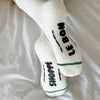 White socks with black text on a white background