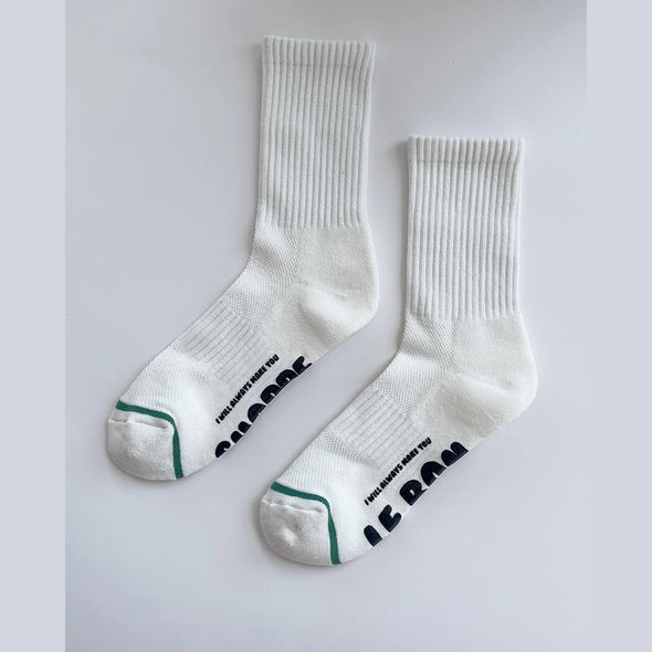 White socks with text on a light gray background