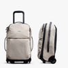 Ash Lite Carry-On 38L by Bellroy rolling suitcase and backpack with black wheels and zippers on a white background