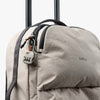light ash backpack with a lock attached, featuring the brand 'bellroy'.