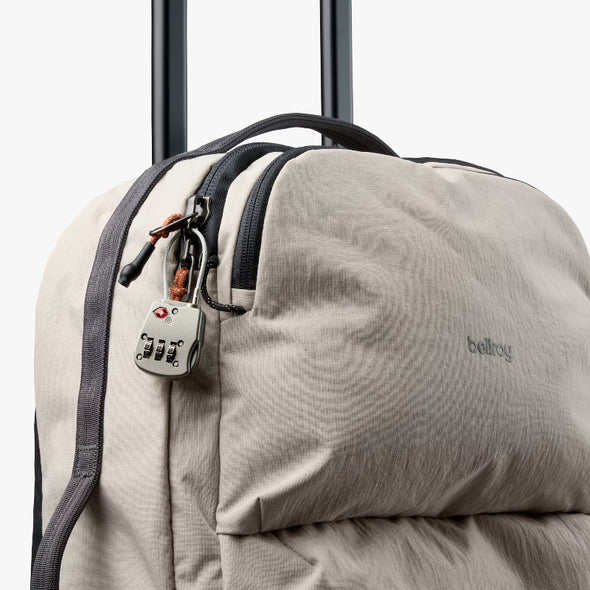 light ash backpack with a lock attached, featuring the brand 'bellroy'.