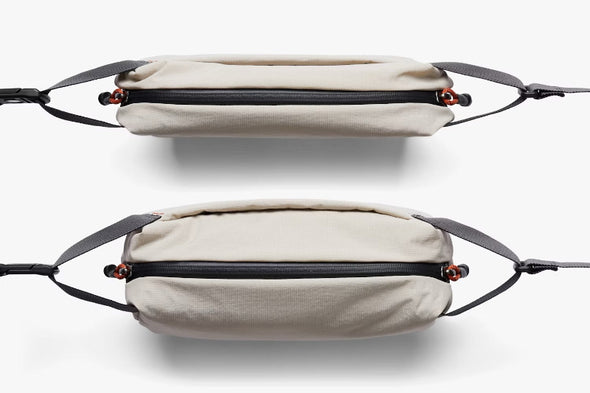 Two ash Bellroy bags with black straps on a white background