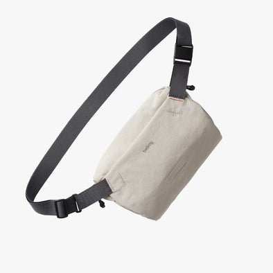 Ash Bellroy sling bag with black strap on a white background