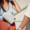 Person wearingLite Sling Mini 4L by Bellroy in Ash