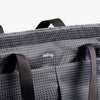Gray bag with geometric pattern and 'bellroy' branding on a white background