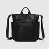 Black leather backpack with shoulder straps on a light gray background