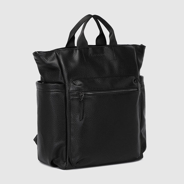 Black leather backpack on a light gray background