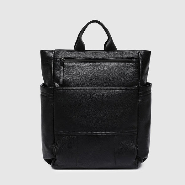 Black leather backpack on a light gray background