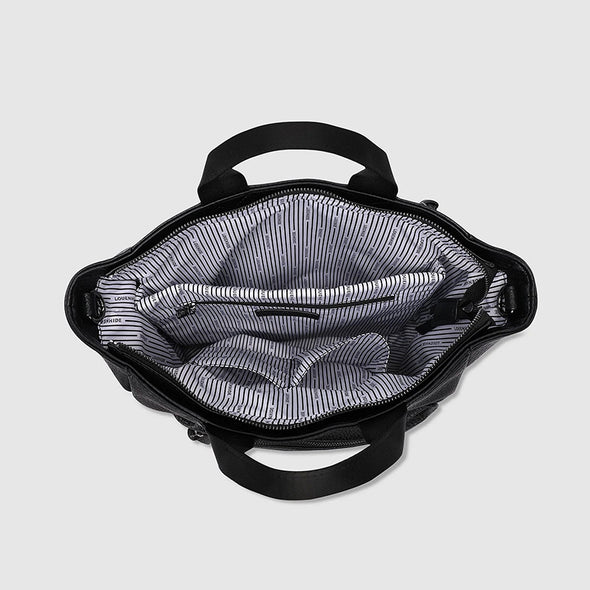 Black backpack with striped lining on a light gray background