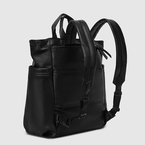 Black leather backpack on a light gray background