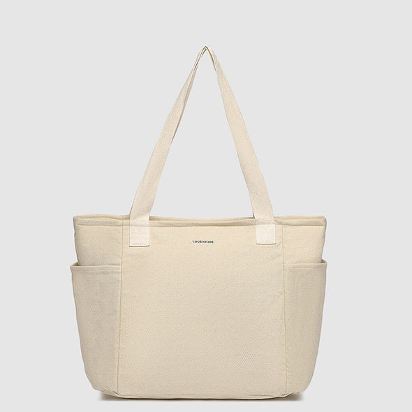 Beige tote bag with straps on a light gray background