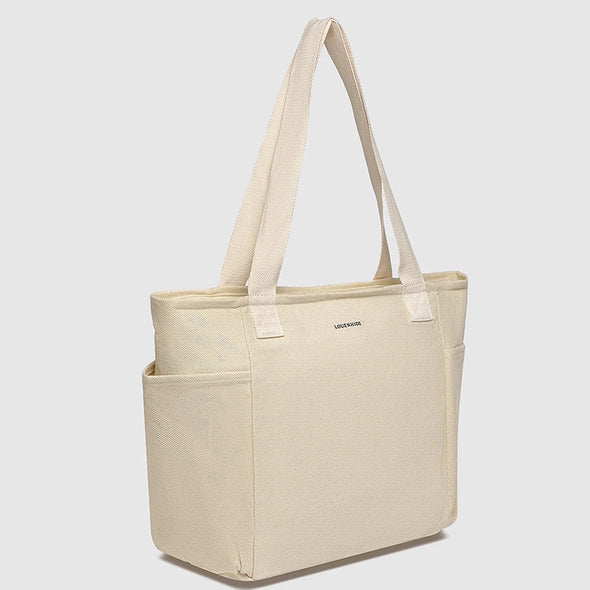 Beige tote bag with a visible brand logo on a light gray background