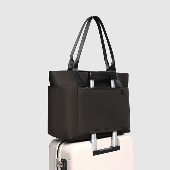 Black tote bag on a light gray background