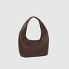 Brown leather handbag on a light gray background