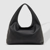 Black handbag on a light gray background