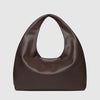 Brown leather handbag on a light gray background