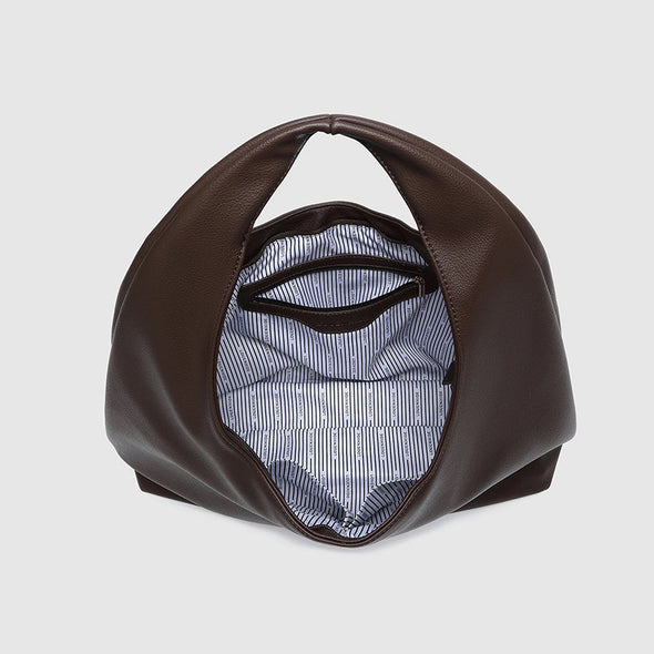 Brown leather handbag with striped lining on a light gray background