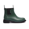Green rubber boot with black sole on a white background