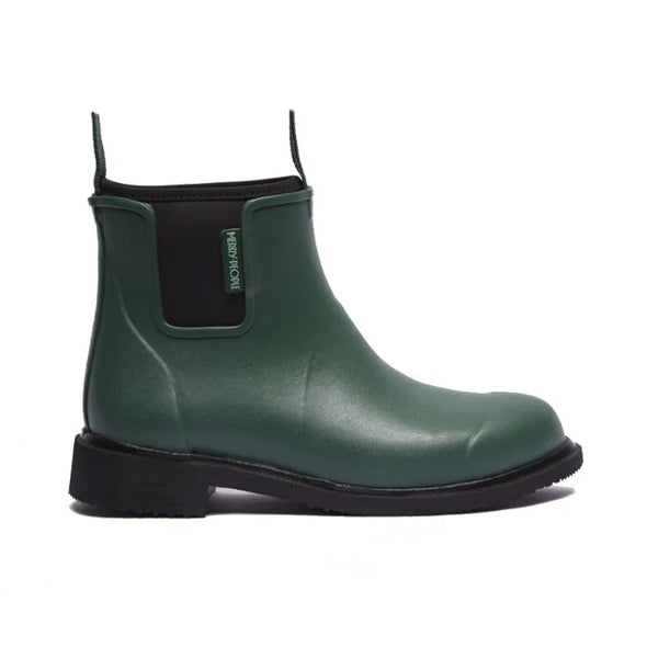 Green rubber boot with black sole on a white background