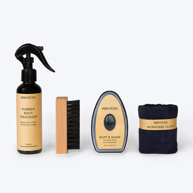 Set of Merry People shoe care products including a spray bottle, brush, and microfiber cloth on a white background.
