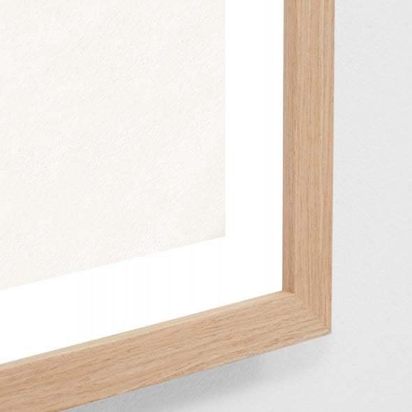 Close-up of a wooden frame corner on a white background