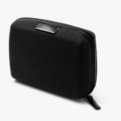 Black zippered pouch with 'bellroy' branding on a white background
