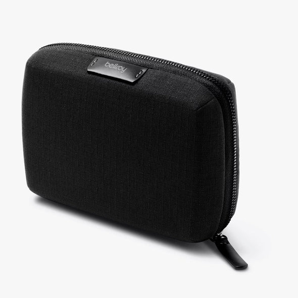 Black zippered pouch with 'bellroy' branding on a white background