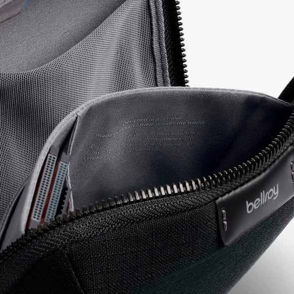 Gray bag with a visible 'bellroy' brand label on a white background