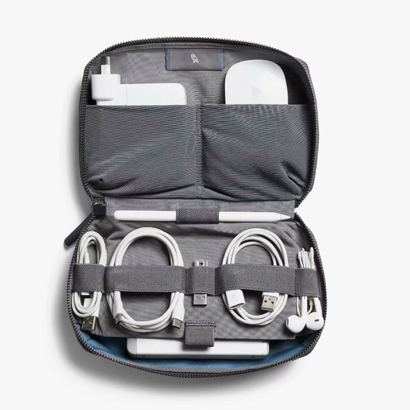 Tech Kit by Bellroy travel organizer with electronic accessories on a white background