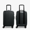 Two black suitcases on a white background