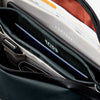 Close-up of a Venture Travel Crossbody by Bellroy Deep Ocean with 'Venture' branding and 'RFID Protected' feature.
