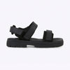 Black sandals with velcro straps on a white background