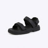 Black sandal with velcro straps on a white background