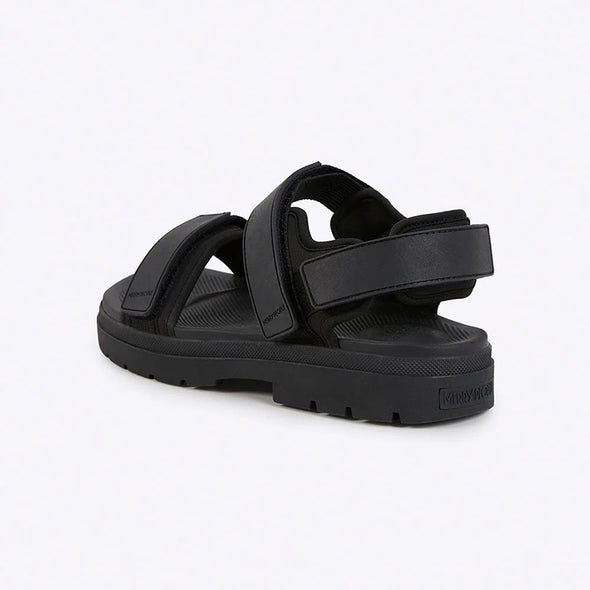 Black sandal with multiple straps on a white background