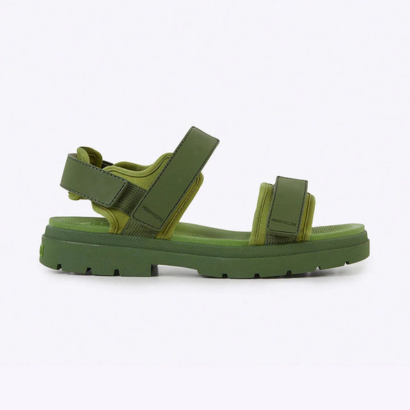 Green sandal with multiple straps on a white background